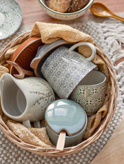 Green Stoneware Pot with Lid and a Spoon