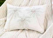Embroidered palm cushion